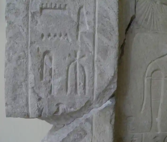 Six-pointed, asymmetrical cross engraved on a funerary stele.